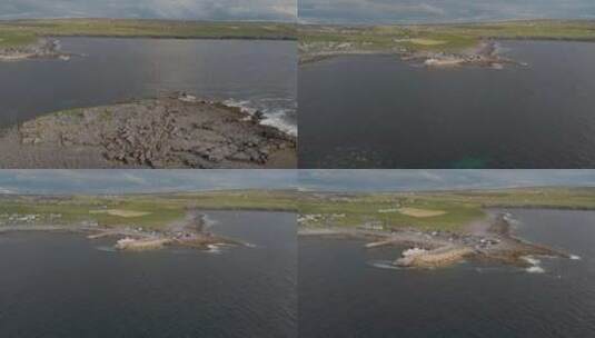 无人驾驶飞机在岩石岛上平稳飞行，向悬崖附高清在线视频素材下载