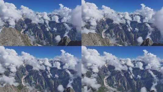 航拍云雾缭绕的贡嘎山卫峰爱德嘉峰雪山风光高清在线视频素材下载