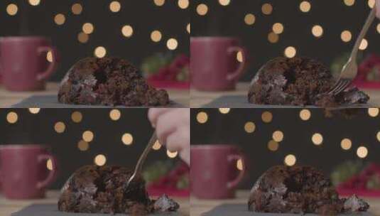 用叉子挑圣诞布丁的特写镜头高清在线视频素材下载