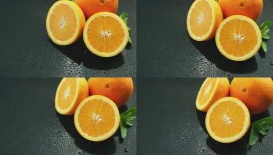 桌上有叶子的橙子特写高清在线视频素材下载