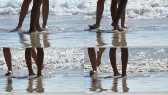 男的和女的脚都站在沙滩上高清在线视频素材下载