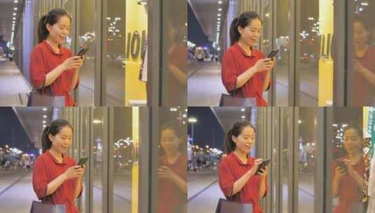 亚洲东方中国女性在商场玩手机沟通联系高清在线视频素材下载