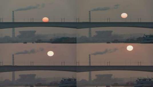 高架桥工厂烟囱水面船只太阳升起高清在线视频素材下载