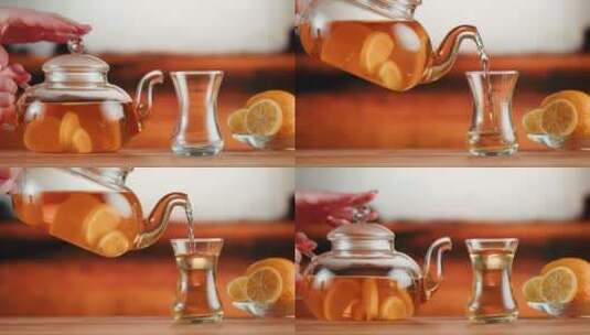将柑橘红茶倒入玻璃杯特写高清在线视频素材下载
