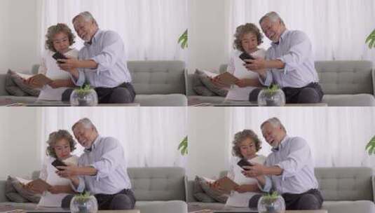 老年人在客厅用智能手机高清在线视频素材下载