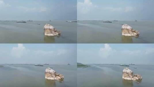 江西省九江市鄱阳湖蛤蟆石环绕航拍高清在线视频素材下载