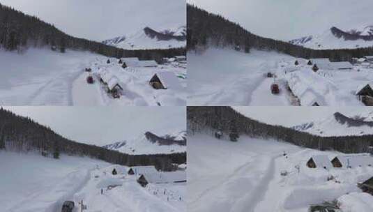 航拍冬季新疆阿勒泰禾木雪景雪山森林村落高清在线视频素材下载