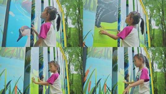 小女孩在户外看卡通画面高清在线视频素材下载