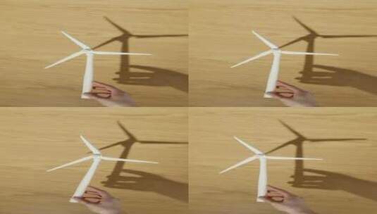 环保概念，手拿着风力发电模型高清在线视频素材下载