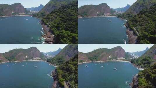 Sugarloaf山悬崖边视图平移到热带红海滩巴西（普拉亚vermelha），蓝色水域高清在线视频素材下载