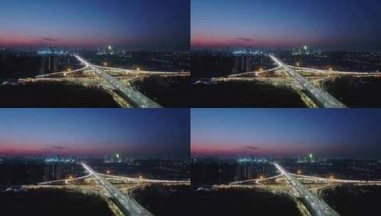 航拍城市天际线与高速公路立交桥高清在线视频素材下载