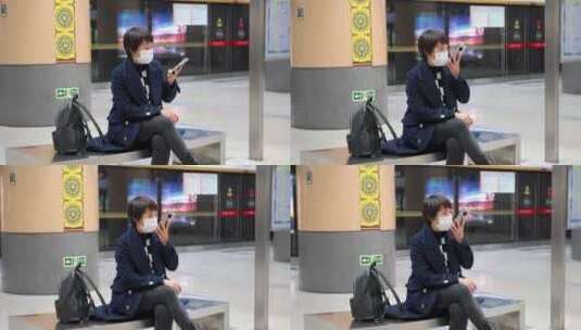 在地铁车站等车使用手机的亚洲女性高清在线视频素材下载