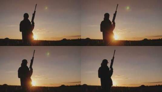 夕阳下女运动员持枪的剪影高清在线视频素材下载
