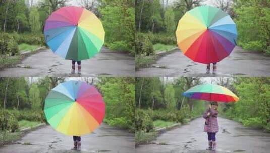 可爱的女孩在旋转雨伞高清在线视频素材下载