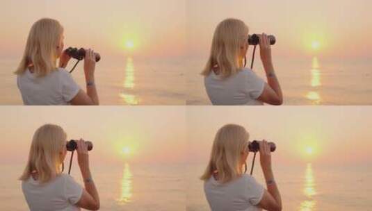 女人用望远镜看海洋上的日出高清在线视频素材下载