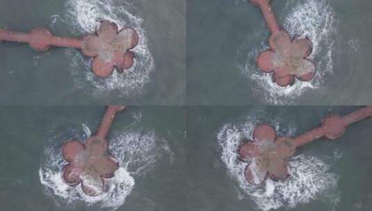 航拍山东威海高区金海湾栈桥的海浪4K高清在线视频素材下载