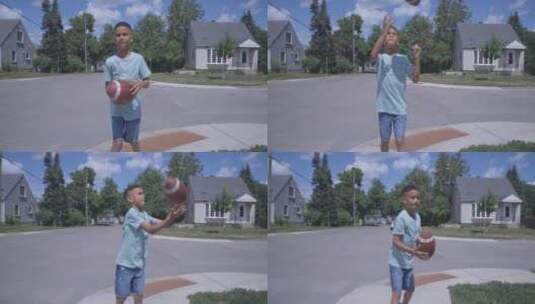 小男孩在街上玩橄榄球高清在线视频素材下载