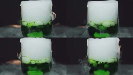一杯绿色液体中的干冰高清在线视频素材下载