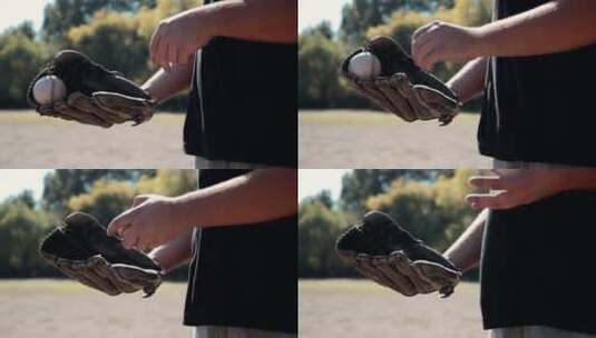 棒球运动员把球扔进手套里高清在线视频素材下载
