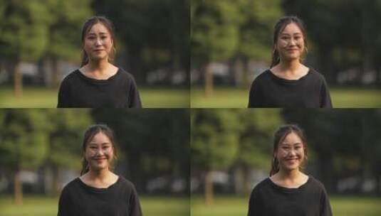 自信阳光女大学生在校园里看镜头微笑肖像高清在线视频素材下载