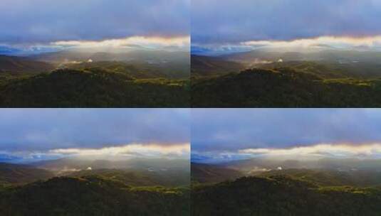 夕阳透过云层染红了山林高清在线视频素材下载