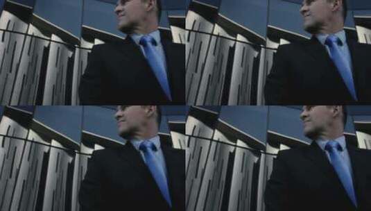 男商人在办公楼前调整领带高清在线视频素材下载