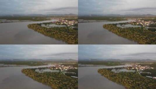 航拍河流边的乡村高清在线视频素材下载