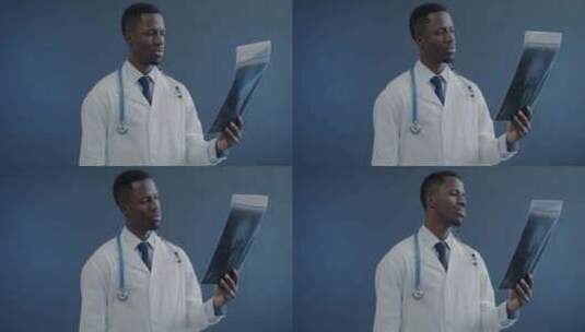 非裔美国医学专家的肖像拿着人类大脑的核磁高清在线视频素材下载