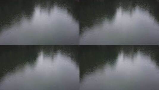 蓝色湖面阴雨绵绵雨滴实拍高清在线视频素材下载