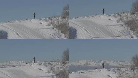 雪山上身穿厚外套的人在眺望远方高清在线视频素材下载