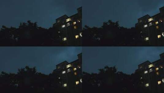 雨夜窗外的城市居民楼灯光和闪电高清在线视频素材下载