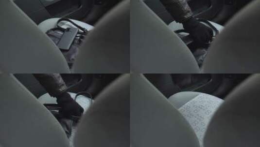 手提包和手机从汽车座椅上被盗高清在线视频素材下载