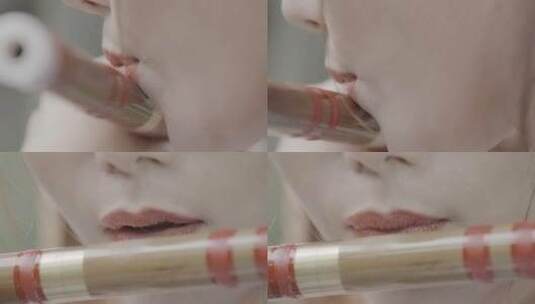 慢镜头古装美女吹笛子视频中国风口红嘴笛子高清在线视频素材下载