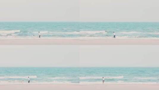 8k实拍夏日海边沙滩上嬉戏的一家人高清在线视频素材下载