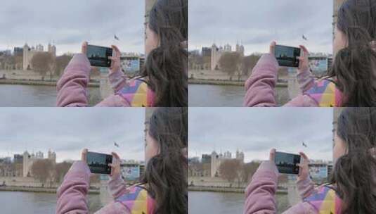 女孩在英国伦敦塔桥旅游用手机拍照高清在线视频素材下载