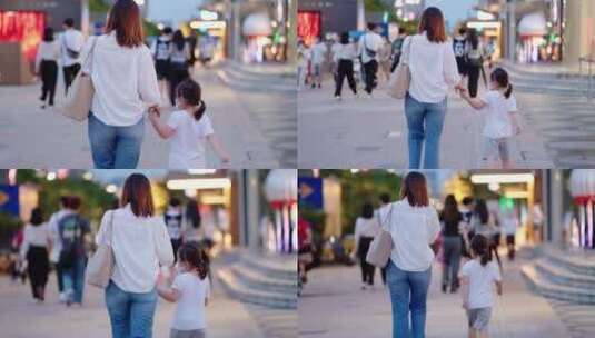 妈妈牵着小女孩的手走路高清在线视频素材下载