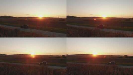 日落时穿越乡村的公路旅行，空中弧线拍摄高清在线视频素材下载