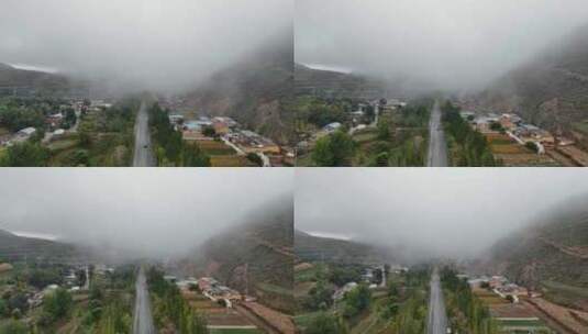 甘肃西北农村公路村落清晨雾气萦绕高清在线视频素材下载