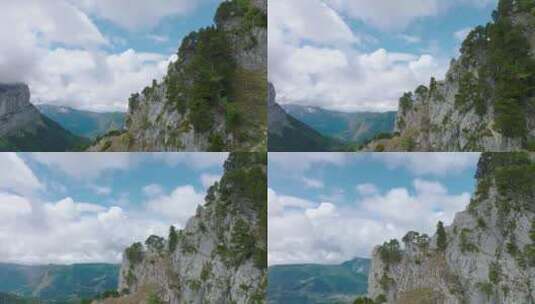 超越悬崖与绿色的松树到多云的山谷，格拉尼高清在线视频素材下载