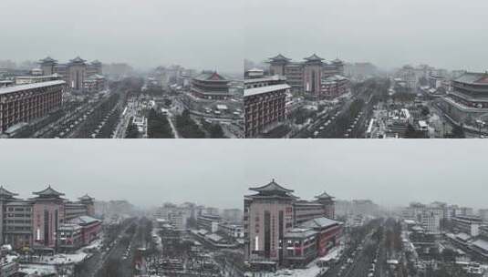 航拍陕西省西安市大雪中的西安钟楼街道风景高清在线视频素材下载