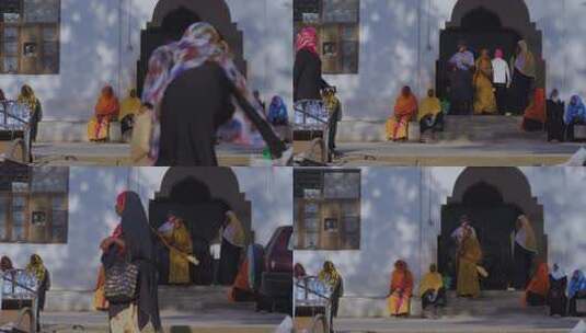 非洲坦桑尼亚街头行人，传统服饰与建筑背景高清在线视频素材下载