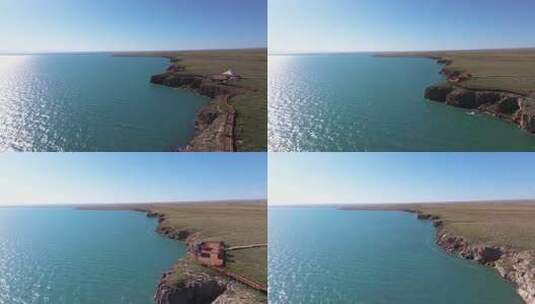 航拍青海湖断崖景区高原圣湖蓝天白云列车高清在线视频素材下载