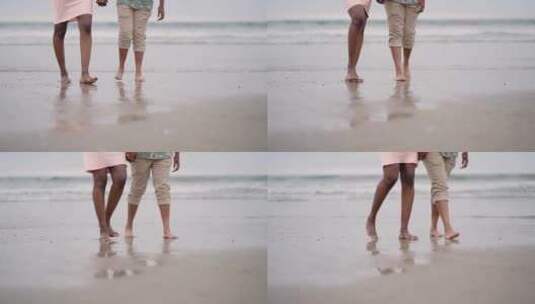 一对在海滩上散步的夫妇高清在线视频素材下载