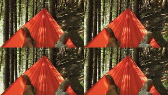 躺在森林里的吊床上高清在线视频素材下载
