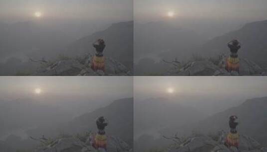 少数民族少女在山崖上喊山呼唤太阳升起03高清在线视频素材下载
