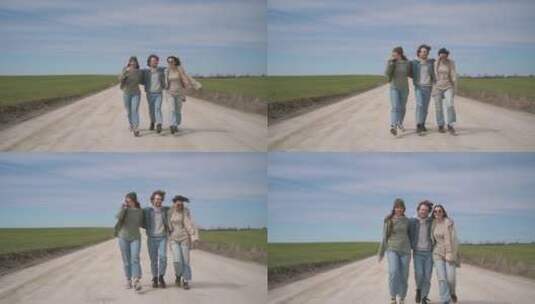 三个人走在田野间的小路上高清在线视频素材下载