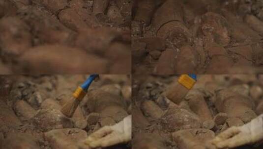 考古学家用刷子清理石像的尘土特写镜头高清在线视频素材下载