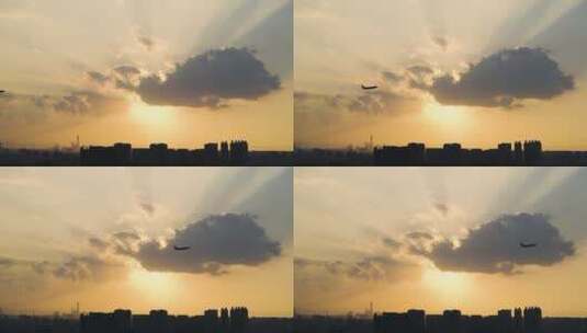 飞机从云层上方飞过放射光芒城市剪影经济高清在线视频素材下载