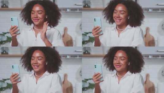 快乐的年轻非裔美国女性在视频通话中挥手微笑高清在线视频素材下载