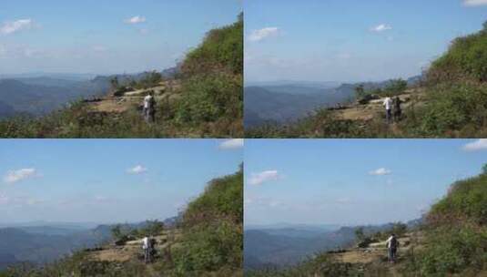 两名驴友在山脊上徒步高清在线视频素材下载